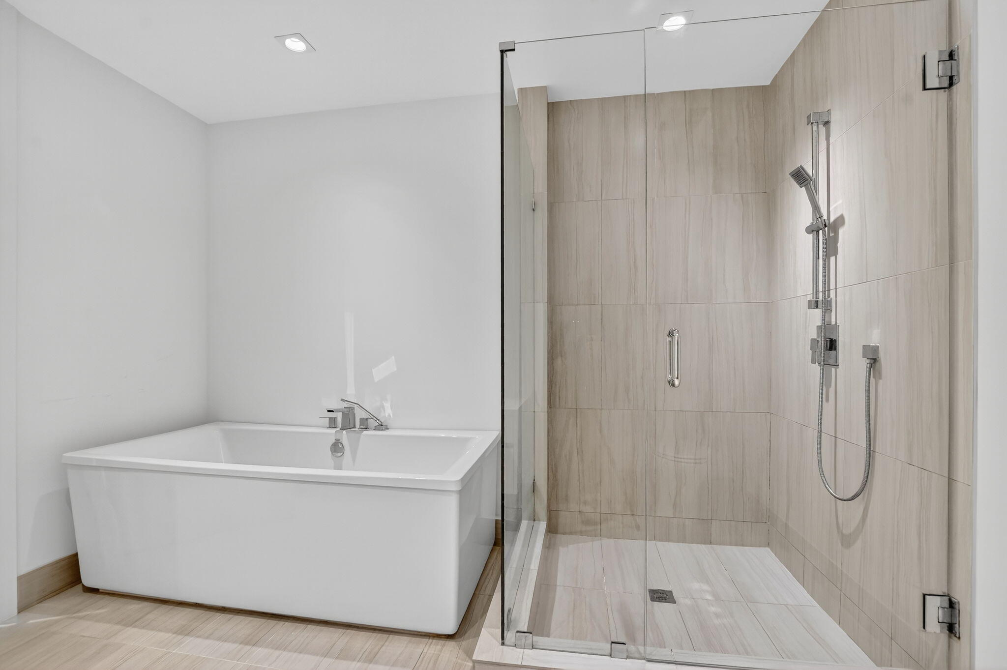 155 East Boca Raton Road, Unit 1014 Boca Raton, FL 33432 - Photo 34 of 62 a white bath tub sitting next to a shower