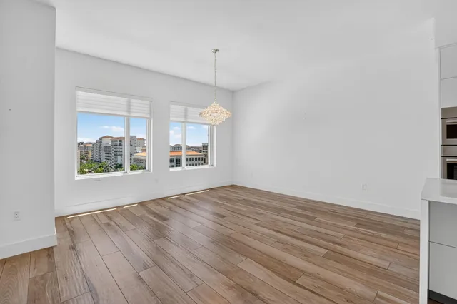 walk in closet with wooden floor