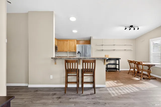 a kitchen with a table and chairs in it
