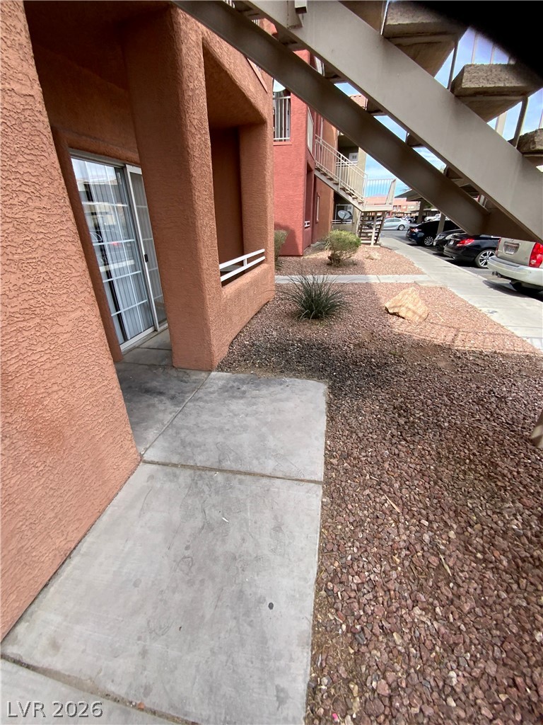 4730 East Craig Road, Unit 1154 Las Vegas, NV 89115 - Photo 4 of 13 Concrete pathways lead to private entrances within this desert-landscaped community.