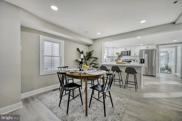 a view of a dining room with furniture and window