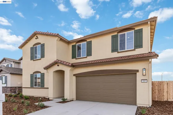 a front view of a house with a garage