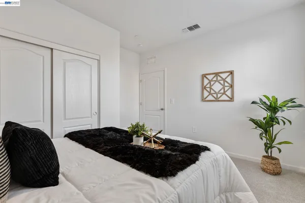 a bathroom with a sink toilet and a mirror