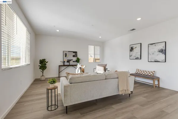 a living room with furniture and a table