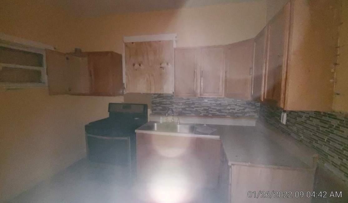 2706 East 78th Street Chicago, IL 60649 - Photo 4 of 10 a view of kitchen with granite countertop