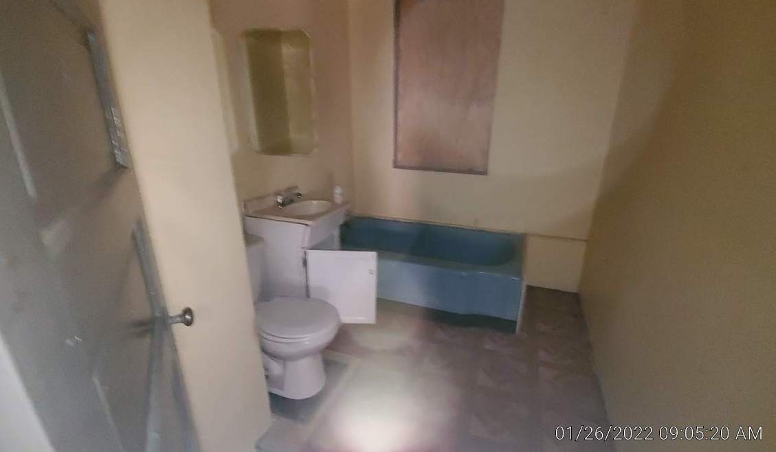 2706 East 78th Street Chicago, IL 60649 - Photo 6 of 10 a bathroom with a toilet and a sink