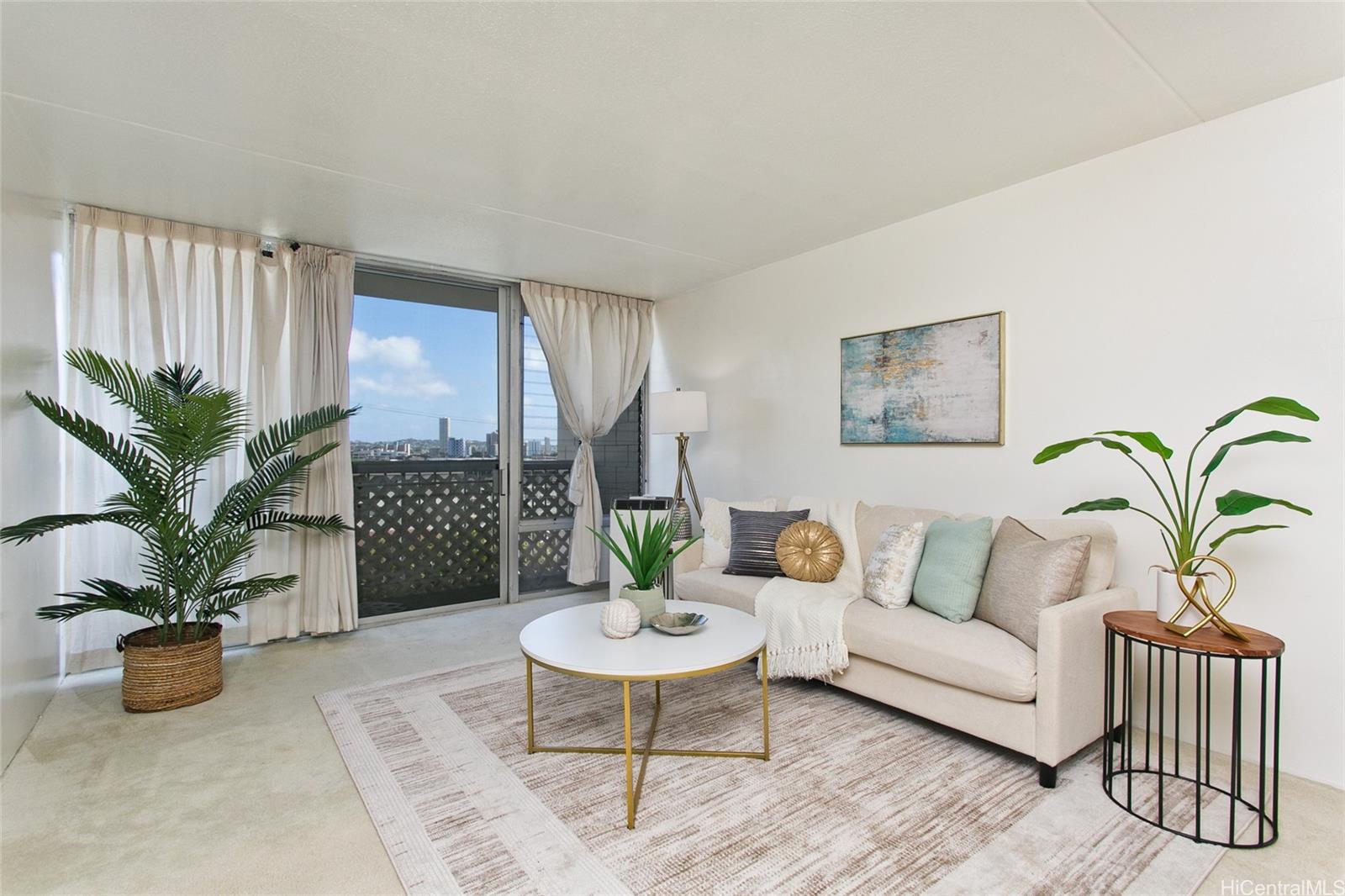 a living room with furniture potted plant and a couch