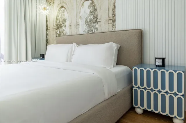 a bedroom with a bed and a lamp with window