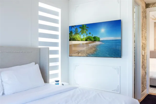 a bedroom with a bed and a couch