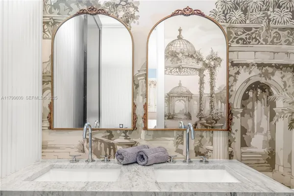 a bedroom with a bed and a mirror