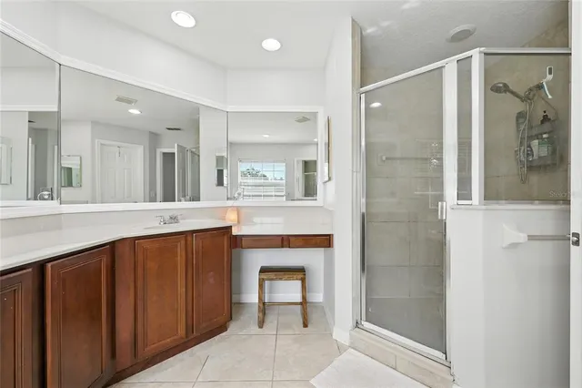 a bedroom with bed and windows