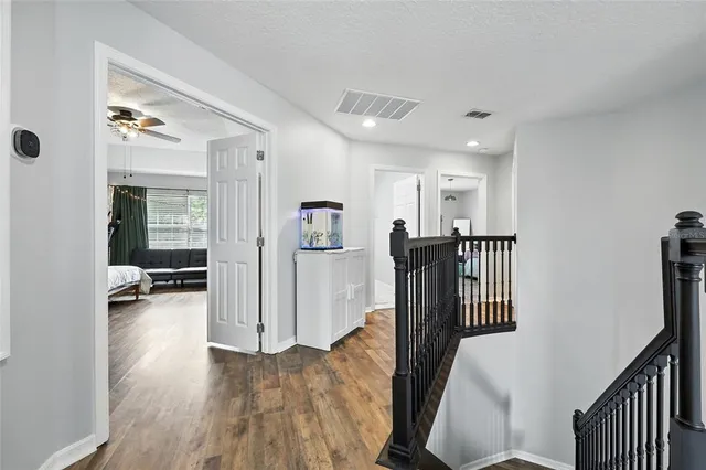 a bedroom with furniture and a baby crib