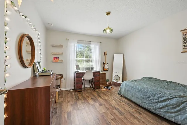 a view of a porch with chairs and backyard