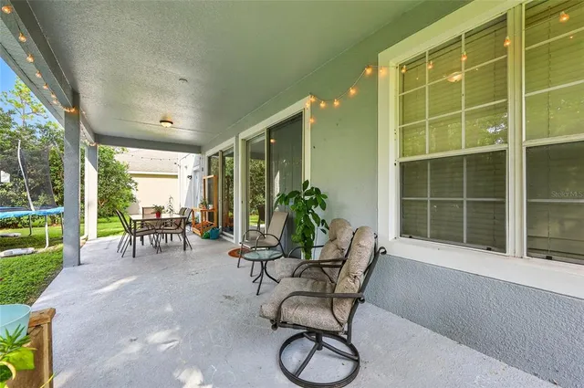 an aerial view of a house with outdoor space patio and entertaining space