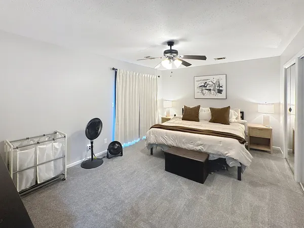 a bedroom with a bed and window