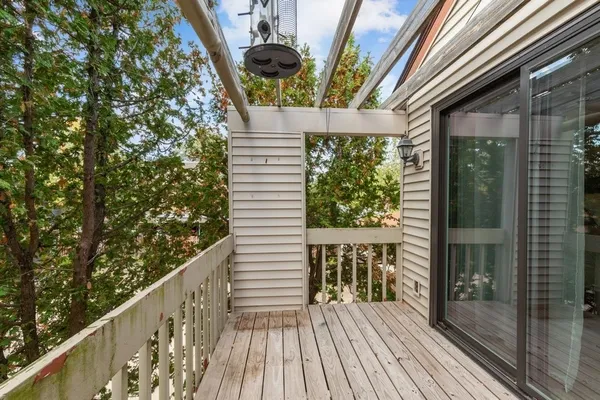 a view of balcony with wooden floor