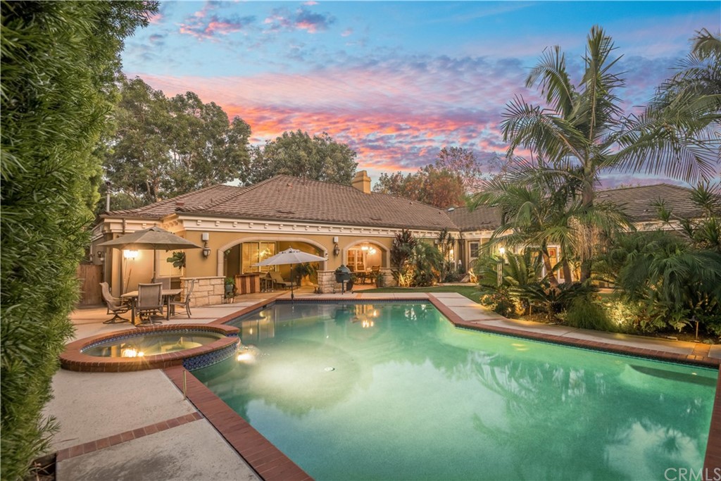 1455 Bryant Drive Long Beach, CA 90815 - Photo 4 of 6 a front view of a house with swimming pool having outdoor seating