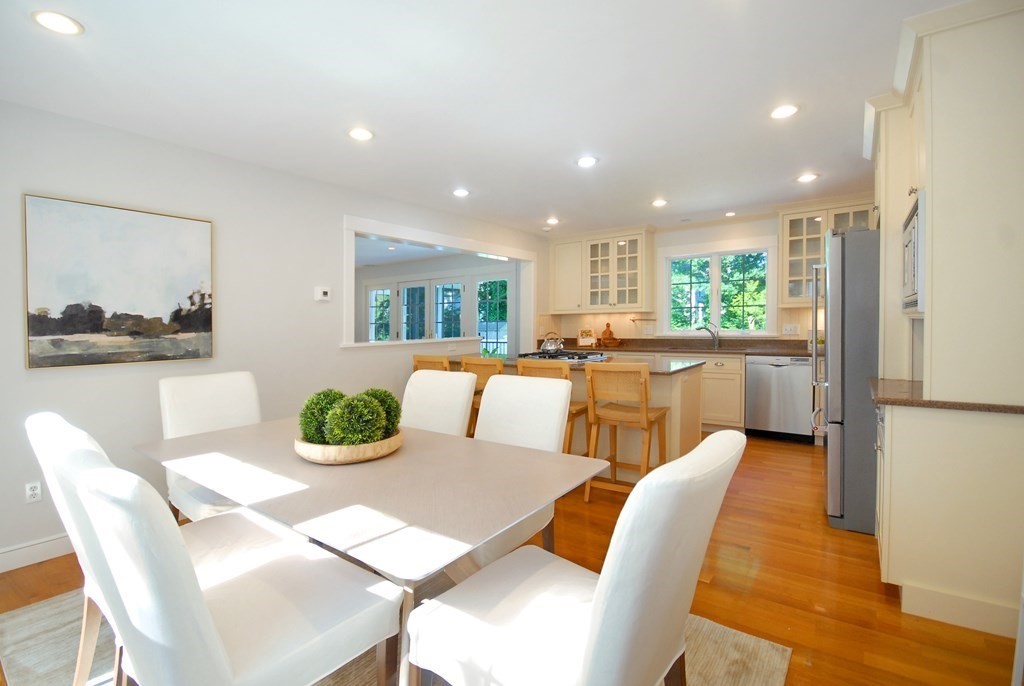 118 Monsen Road Concord, MA 01742 - Photo 15 of 34 a view of a dining room with furniture a kitchen and wooden floor