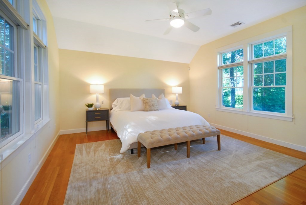 118 Monsen Road Concord, MA 01742 - Photo 16 of 34 a bedroom with a bed and wooden floor next to a window