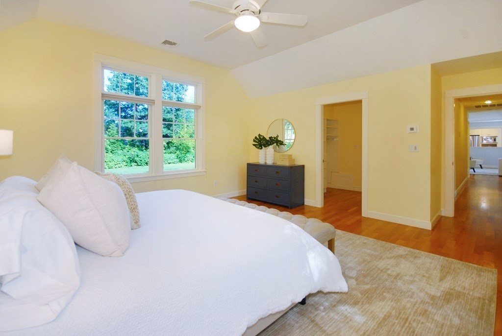 118 Monsen Road Concord, MA 01742 - Photo 17 of 34 a bedroom with a bed and a potted plant