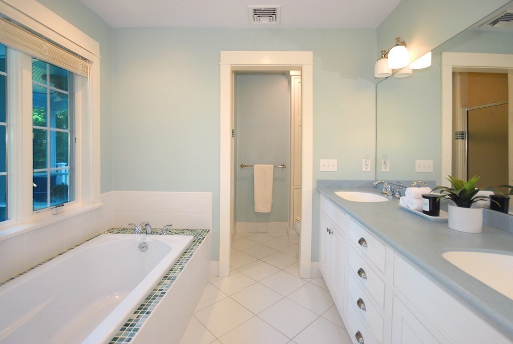 118 Monsen Road Concord, MA 01742 - Photo 19 of 34 a bathroom with a tub sink and mirror