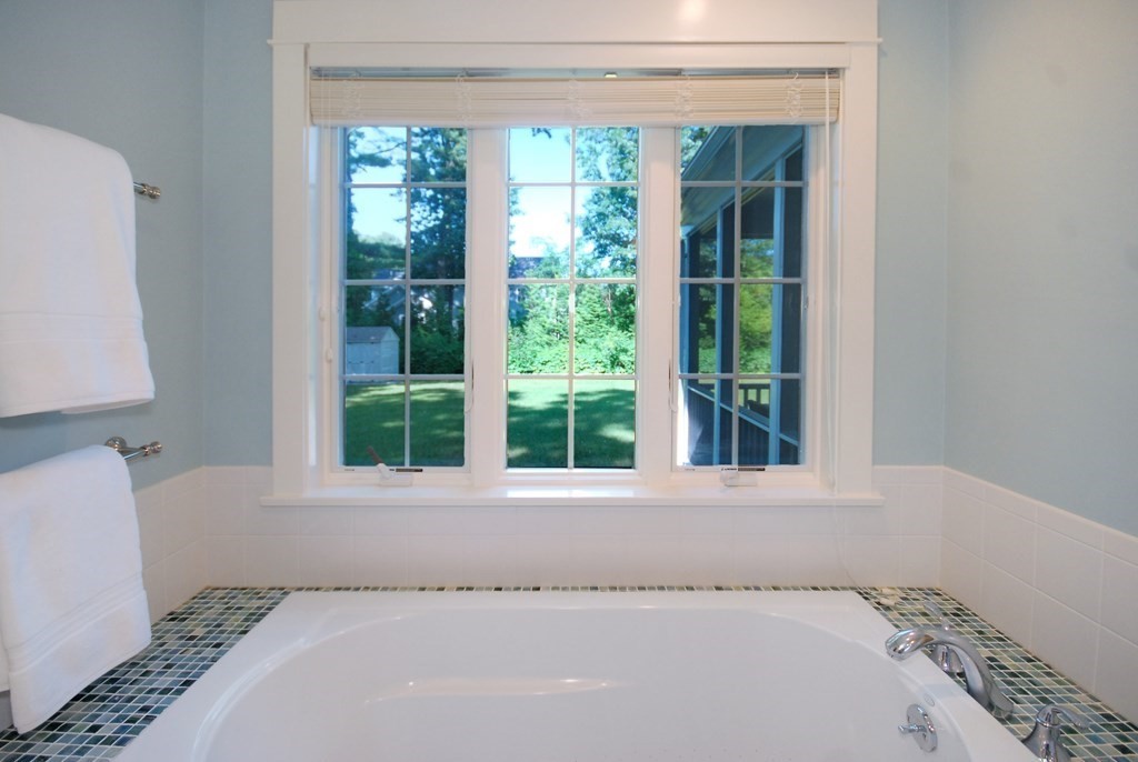 118 Monsen Road Concord, MA 01742 - Photo 20 of 34 a view of a bedroom with a bed and a window