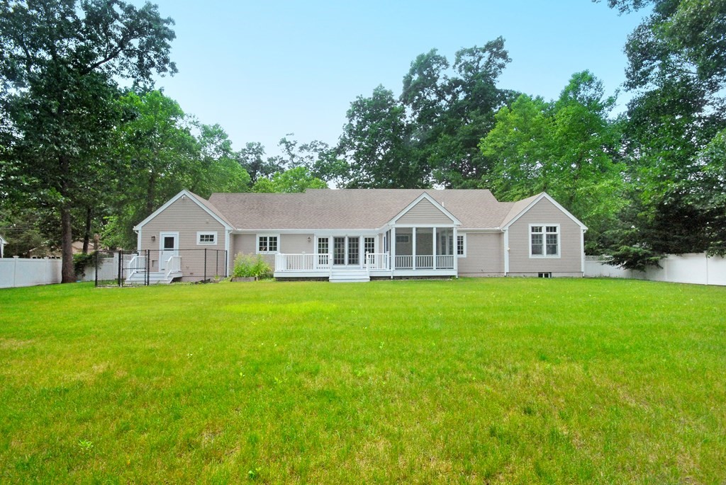 118 Monsen Road Concord, MA 01742 - Photo 2 of 34 a front of a house with a yard and large trees