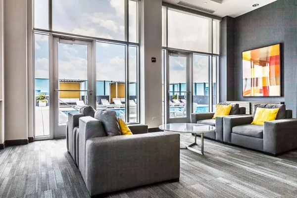 a living room with furniture and a large window