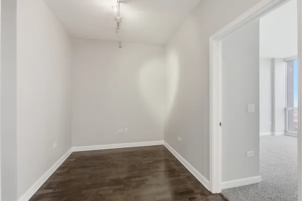 a view of a small space with wooden floor