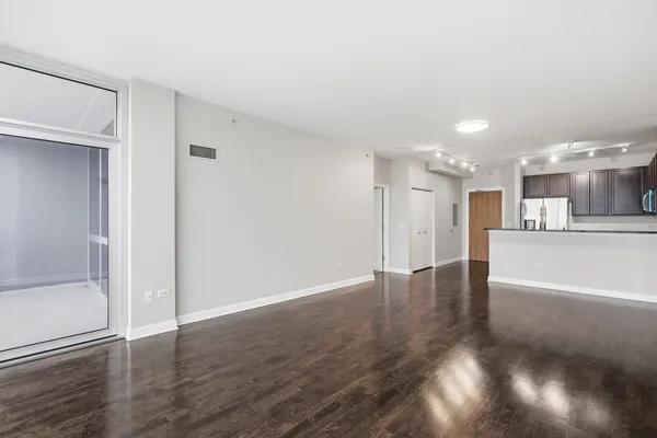 a view of kitchen with wooden floor