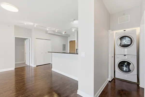 a view of livingroom with washer and dryer