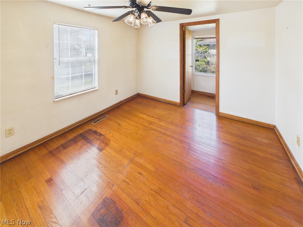 834 Lake Washington Road Washington, WV 26181 - Photo 11 of 20 Bedroom with hardwood / wood floors and a ceiling fan