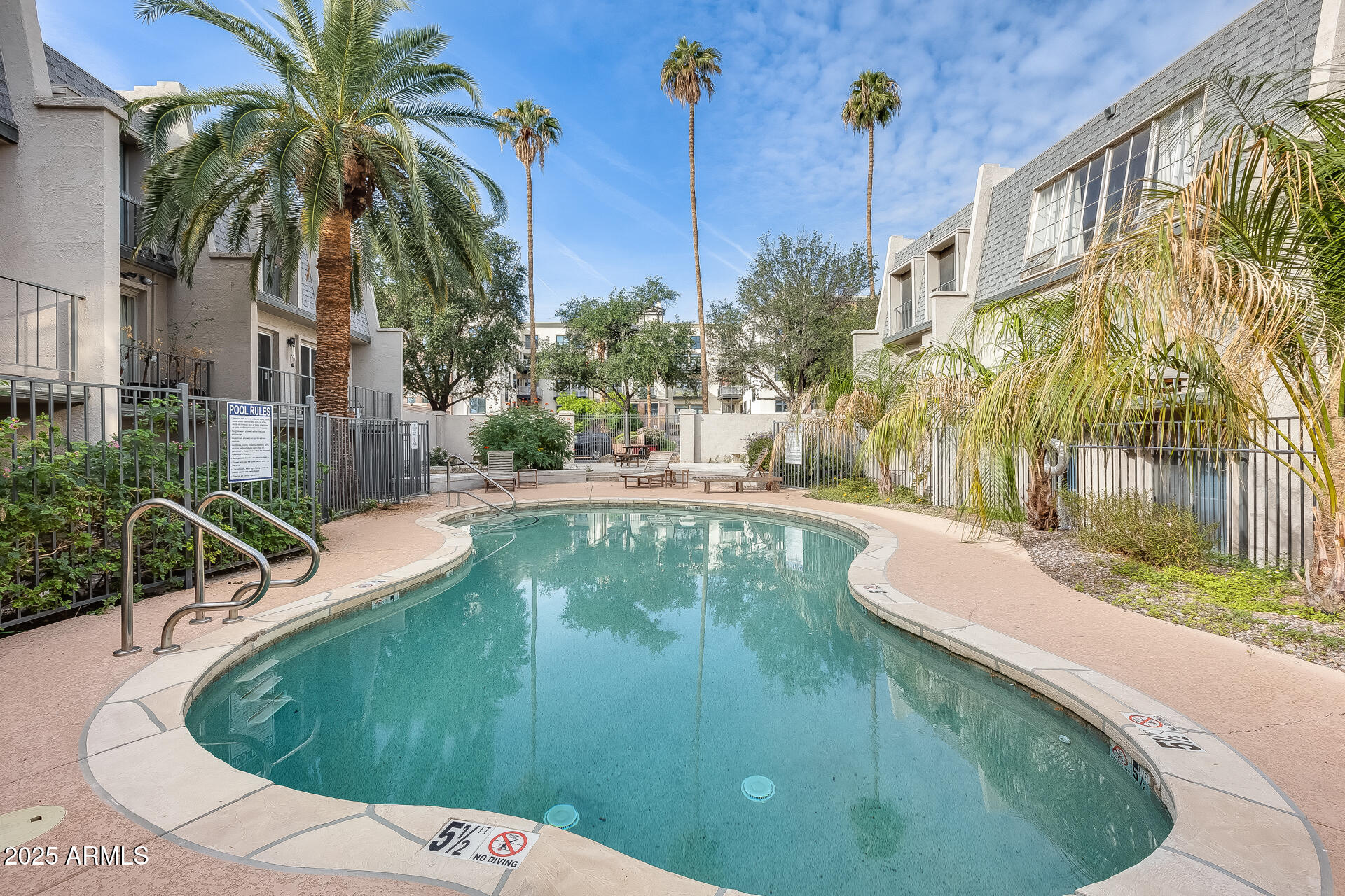 a view of a swimming pool with a patio