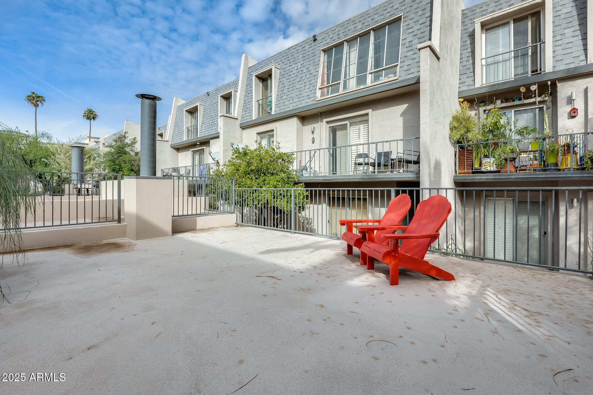 1024 East Osborn Road, Unit A Phoenix, AZ 85014 - Photo 2 of 20 a wooden bench sitting in front of a building