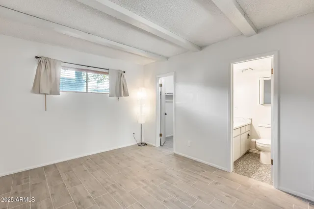 a kitchen with a refrigerator sink and cabinets