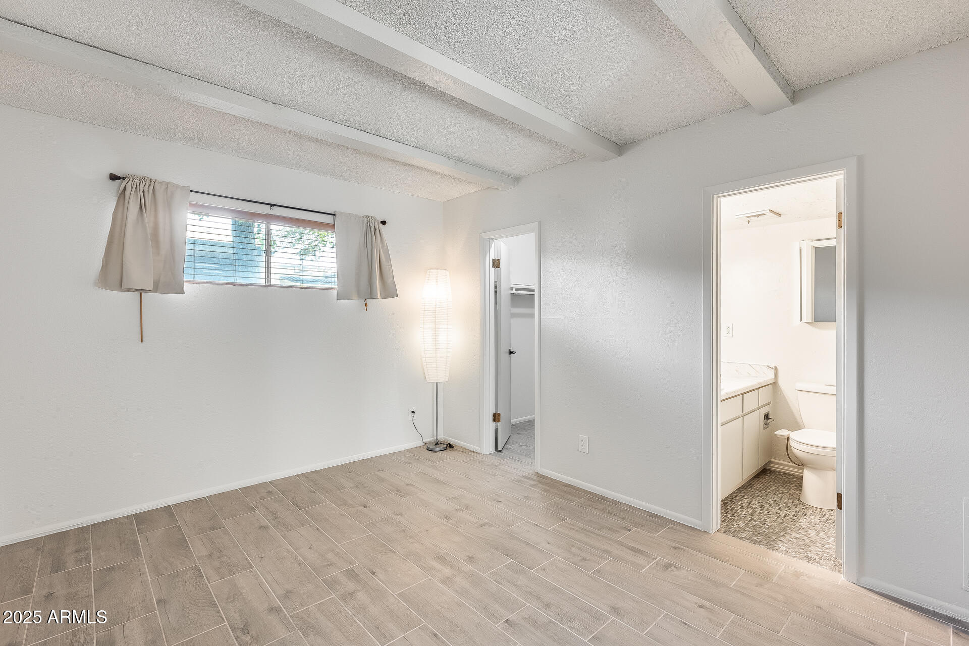 1024 East Osborn Road, Unit A Phoenix, AZ 85014 - Photo 9 of 20 a view of a room that has a bed in it