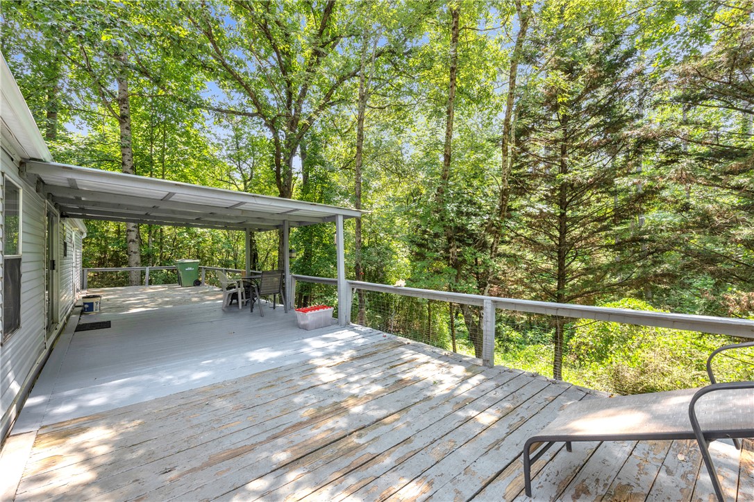 162 Newberry Road Walhalla, SC 29691 - Photo 29 of 50 Enjoy the peaceful surroundings from this spacious outdoor deck, perfect for relaxation or entertaining amidst the trees.