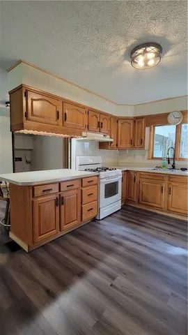 a view of a dining room with furniture and a window