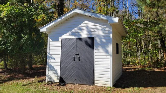 a view of a park with large trees