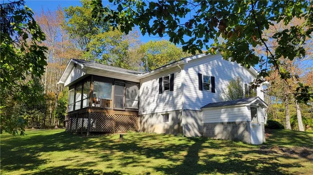 a backyard of a house with lots of green space