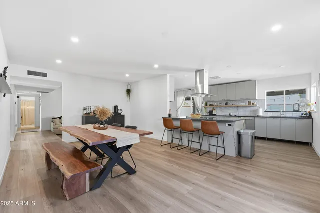 a kitchen with a table and chairs in it