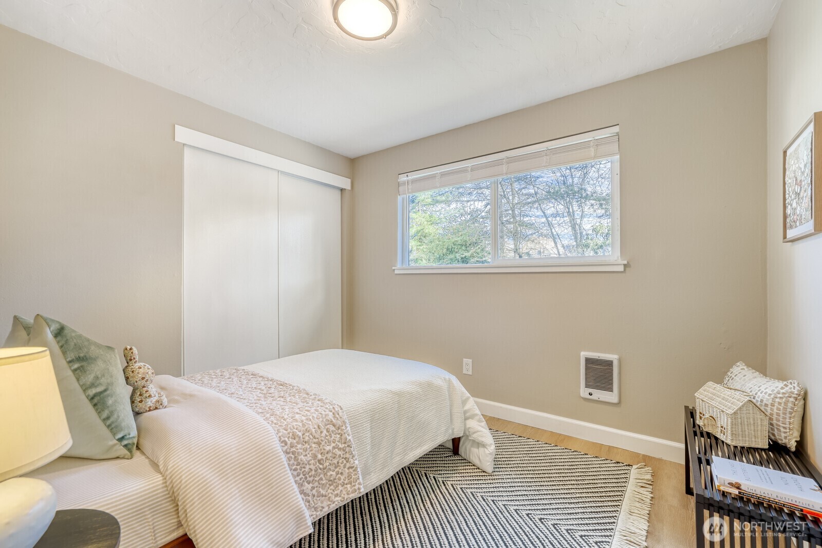 112 Raspberry Lane Sultan, WA 98294 - Photo 12 of 25 a bedroom with a bed and wooden floor