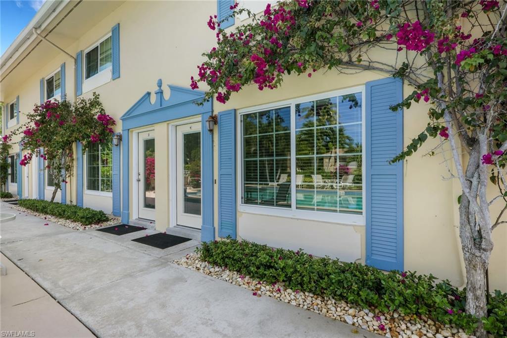 230 3rd Avenue South, Unit 4 Naples, FL 34102 - Photo 14 of 22 a front view of a house with a porch