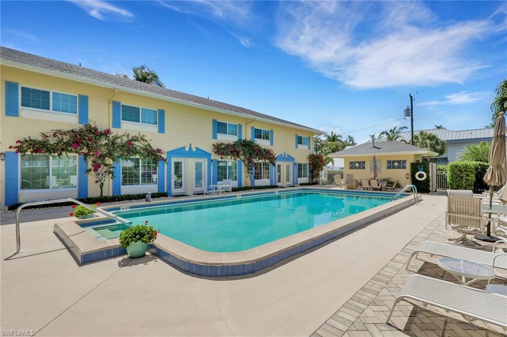 230 3rd Avenue South, Unit 4 Naples, FL 34102 - Photo 17 of 22 a view of a house with a swimming pool