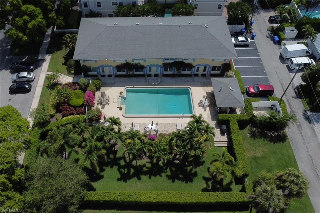 230 3rd Avenue South, Unit 4 Naples, FL 34102 - Photo 20 of 22 an aerial view of a house with a yard and lake view