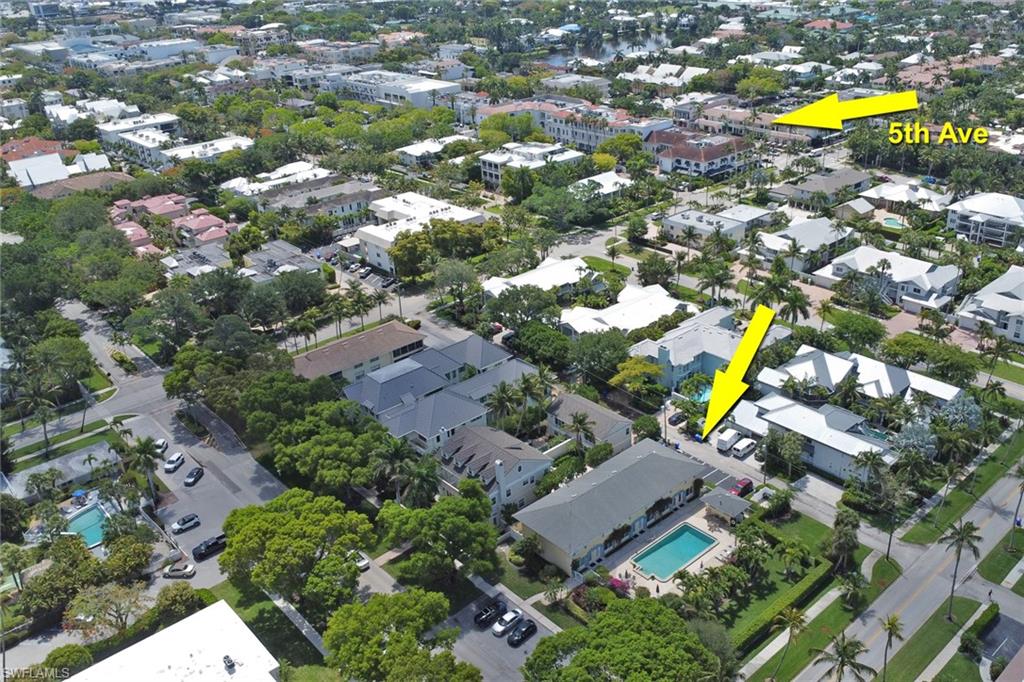 230 3rd Avenue South, Unit 4 Naples, FL 34102 - Photo 21 of 22 an aerial view of residential house with swimming pool and green space