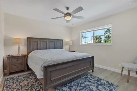 a bedroom with a bed and a table in it