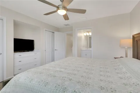 a view of a bedroom and a flat screen tv
