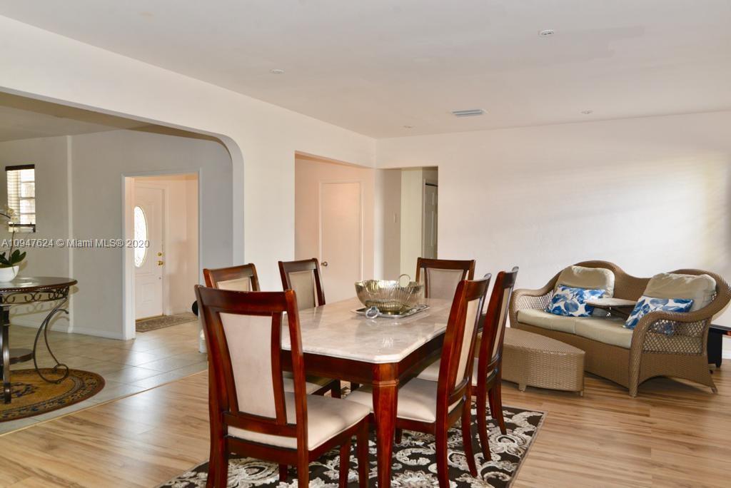 1905 North Park Road Hollywood, FL 33021 - Photo 8 of 29 a dining room with furniture and wooden floor