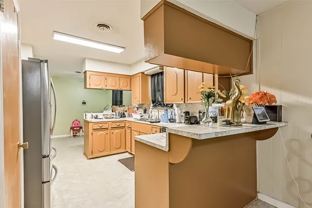 a kitchen with a sink cabinets and window